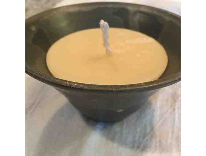 Artisan candle in ceramic bowl