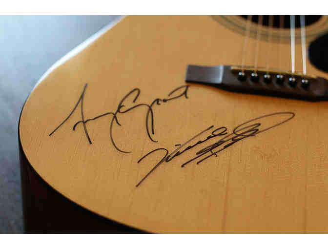 Guitar signed by Amy Grant and Vince Gill
