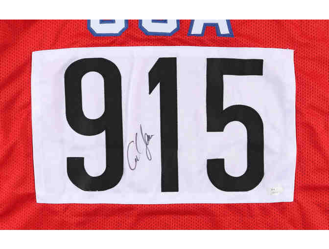 Enjoy legendary track star Carl Lewis USA Signed Jersey (JSA Hologram)