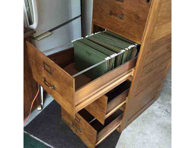 Four Drawer (legal size) wooden file cabinet.