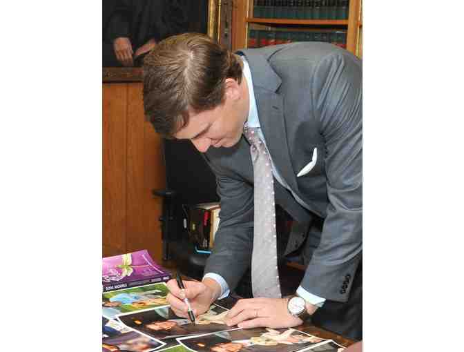 Autographed Photo of Eli Manning with Guiding Eyes Puppy - BUY NOW