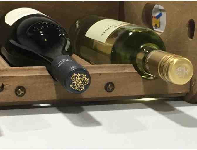 Wine rack stocked with 6 bottles of wine