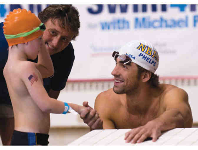 Signed Michael Phelps swim cap and  Foundation swag