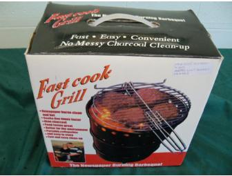 Coupon for an oil change at 'Lawless' accompanied by a sports theme gift basket