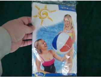 Coupon for an oil change at 'Lawless' accompanied by a sports theme gift basket