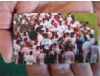 Coupon for an oil change at 'Lawless' accompanied by a sports theme gift basket