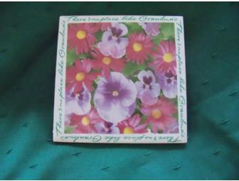 $25 Gift Card to the Woburn Florist accompanied by a pansy theme gift basket