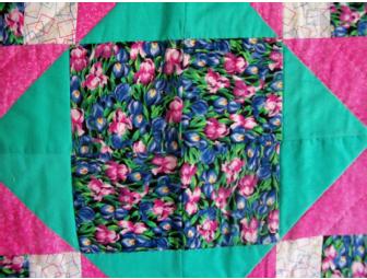 Floral theme package includes a 60' handmade quilt and original framed tulip watercolor