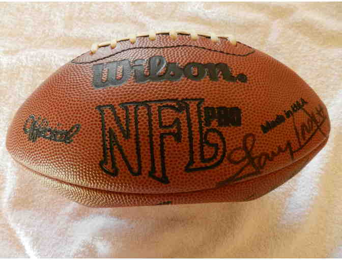 Autographed Football signed by Gayle Sayers Red Grange Jim Brown and others