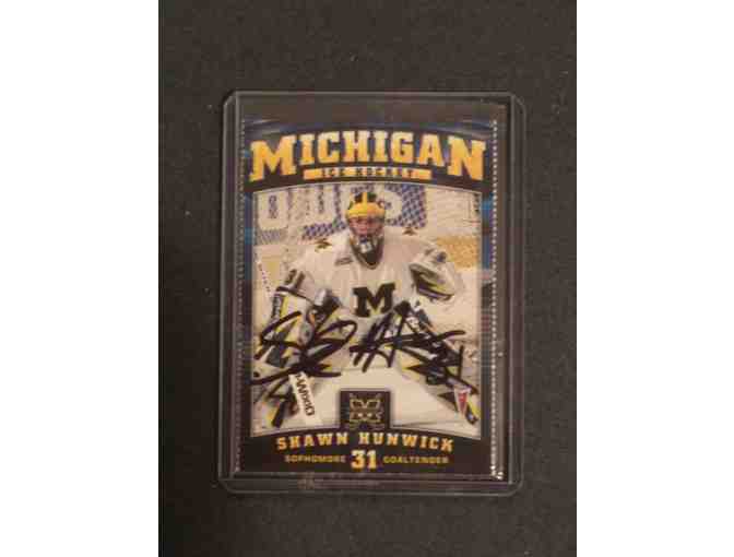 Shawn Hunwick autographed Michigan hockey puck and card