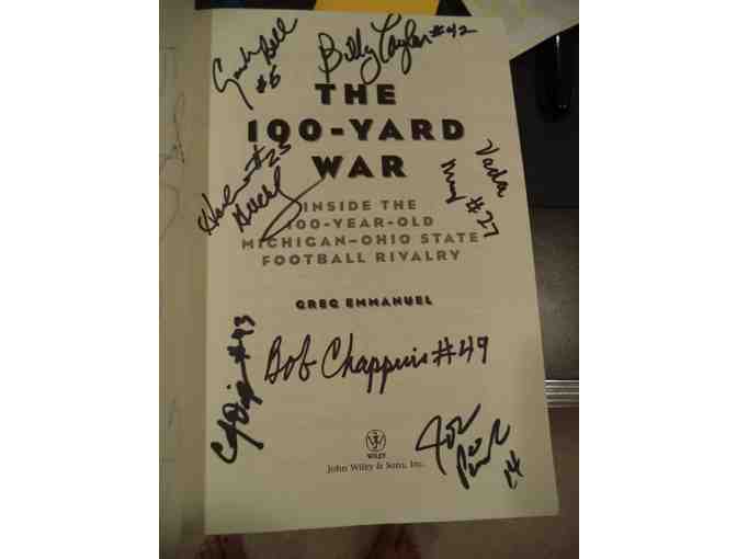 '100 Year War' book about M vs. OSU rivalry autographed by 19 former M football players