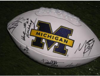 Michigan football signed by 15 former players including A.C. and Jake Long