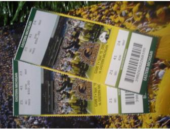 Two Michigan vs. EMU 20 yd line seats and an photo autographed by 10 Michigan Football legends.