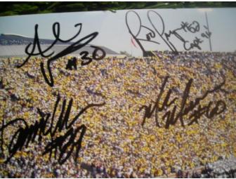 Two Michigan vs. EMU 20 yd line seats and an photo autographed by 10 Michigan Football legends.