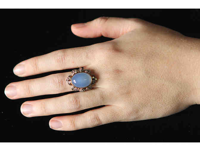 Blue Chalcedony Ring set in 18K yellow gold with 16 round diamonds