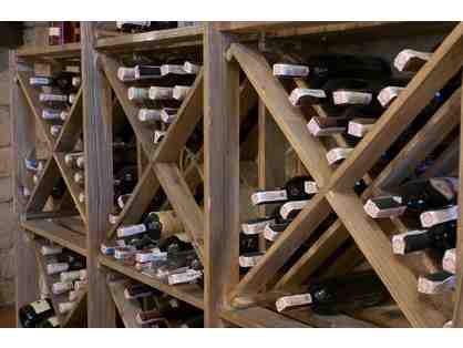 Hand-crafted X frame wine rack filled with curated wines
