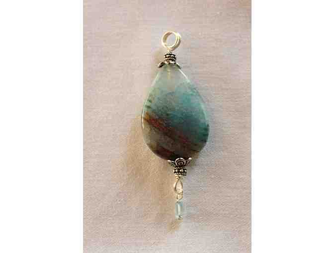 Silver plated pendant with polished stone and blue quartz accent