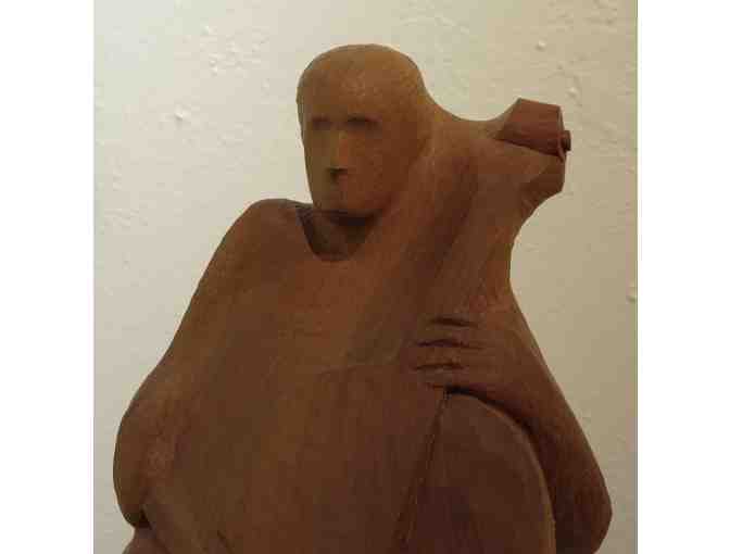 Cello Player (wood carving, 12'H x 7'D x 8'W), Paul Reiber
