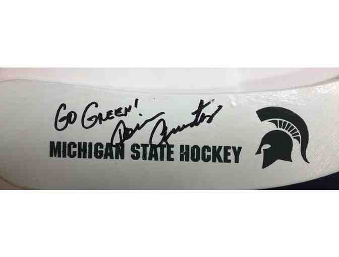 Autographed Hockey Stick and Puck from MSU Hockey Coach Tom Anastos