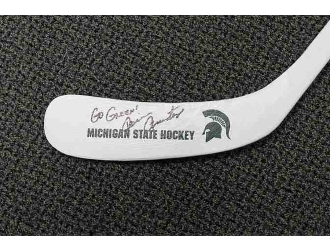 Autographed Hockey Stick and Puck from MSU Hockey Coach Tom Anastos