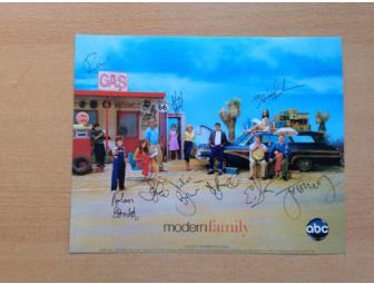 'Modern Family' DVDs, signed cast photo and T-shirts