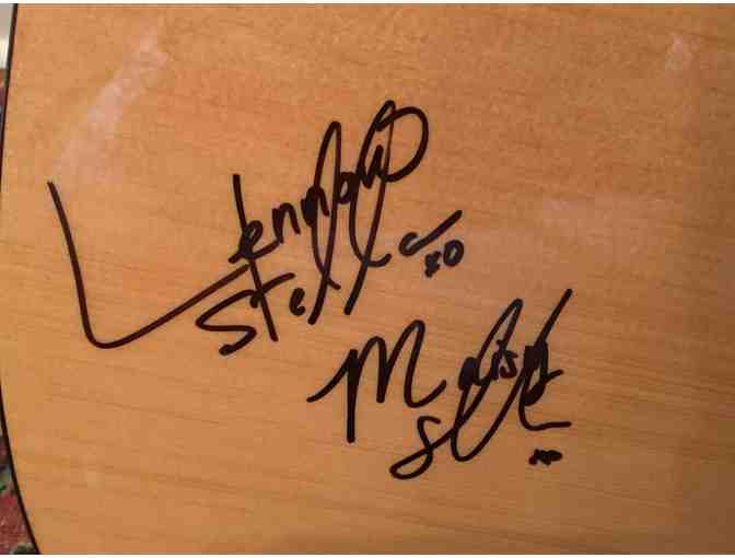 Lennon and Maisy signed acoustic guitar