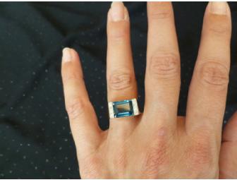 Gold ring with diamonds and blue topaz