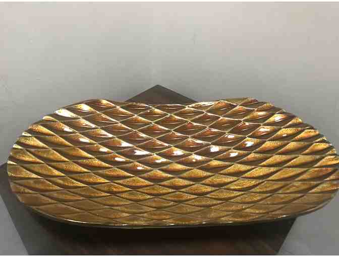 Gold oval decorative platter.