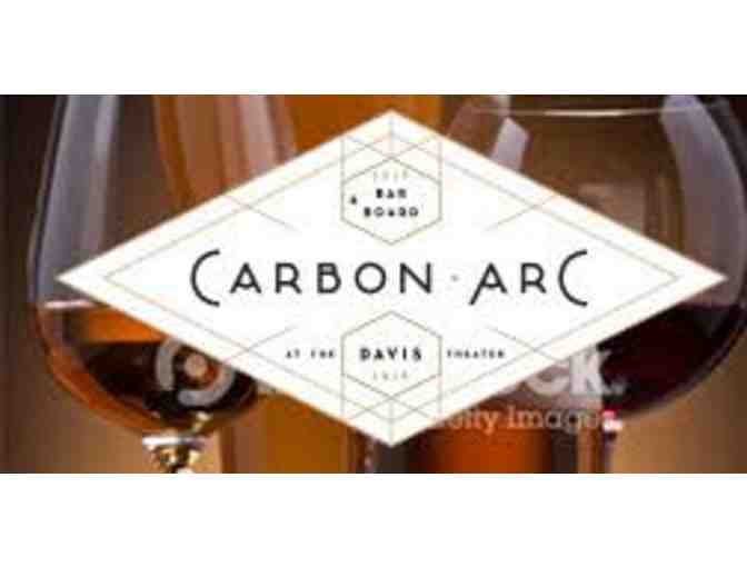 2 movie passes to the Davis Theater and $20 at Carbon Arc