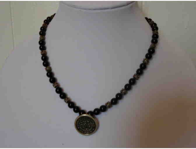 Onyx and silver necklace with a New Orleans Water Meter pendant