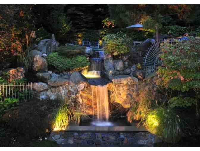 A gift certificate for $3,000 towards the installation of landscape lighting