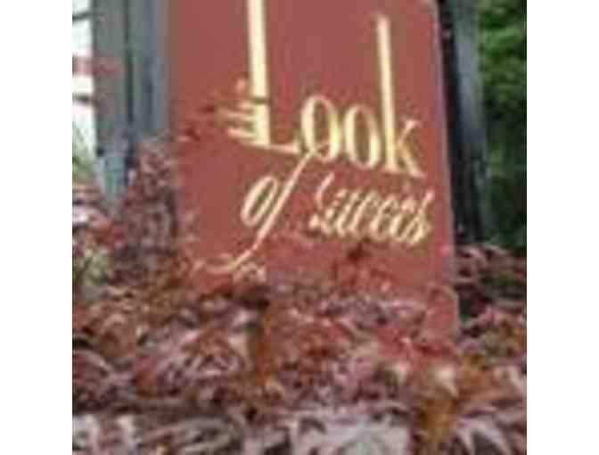 A gift certificate for a woman's haircut with Rosa at The Look of Success