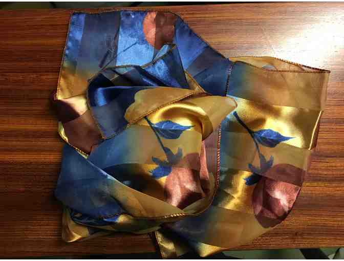 Three fashion scarves of silk and assorted materials.