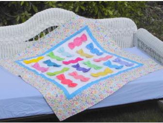 White Wicker Daybed & Quilt