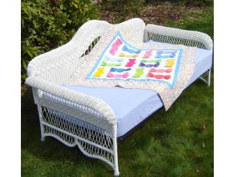 White Wicker Daybed & Quilt