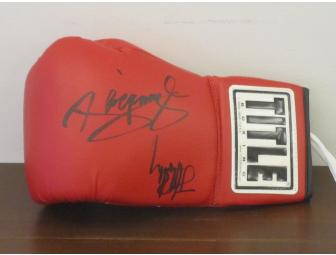 Autographed boxing glove by Manny Pacquiao and Joshua Clottey