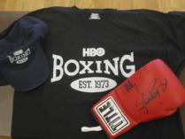 Autographed boxing glove by Manny Pacquiao and Joshua Clottey