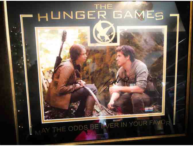 Hunger Games Framed Photo Signed by Jennifer Lawrence and Liam Hemsworth