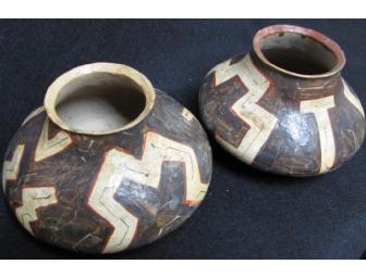 Two primitive pottery vessels