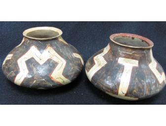 Two primitive pottery vessels