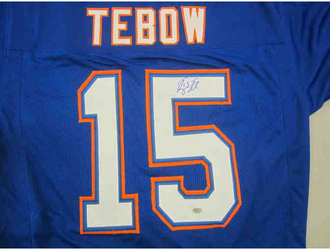 Tim Tebow Autographed Florida Gators Jersey and Autographed Tim Tebow Biography