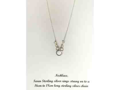 Sterling silver necklace with seven rings