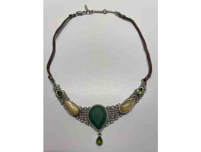 Necklace with various stones on metal linked base on a leather cord.(JP)
