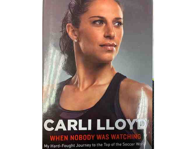 Autographed Carli Lloyd Soccer Ball and Carli Llyod When Nobody Was Watching Book