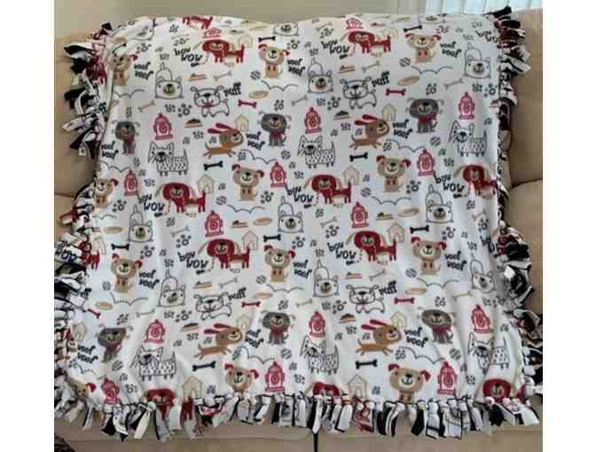 Stay Warm with This Fleece Blanket Featuring Dogs