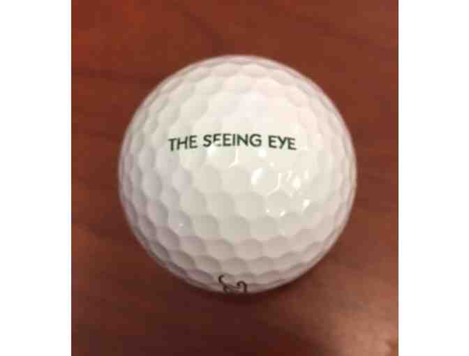 Seeing Eye Green Golf Visor and 24 Titleist Golf Balls Stamped With The Seeing Eye