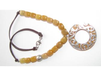 Sterling silver and serpentine pendant with lobster clasp on brown leather chain