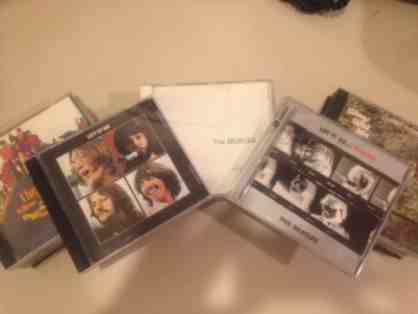 11 Beatles CDs and 10 Paul McCartney and Wings CDs