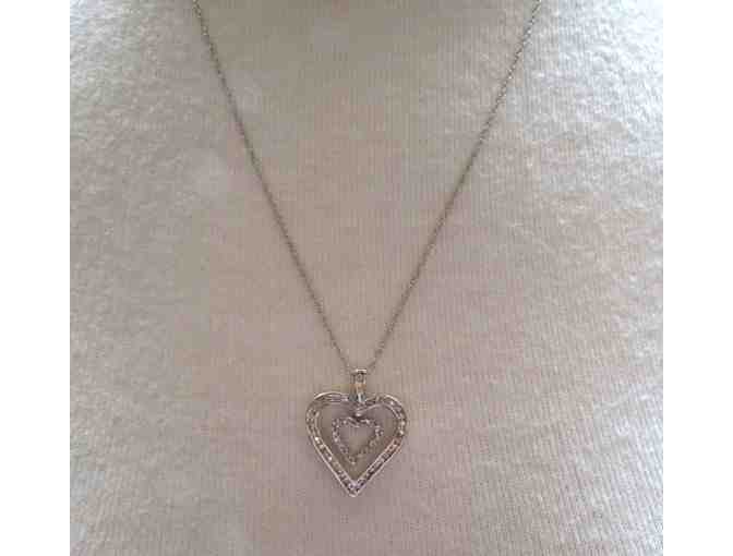 White gold diamond heart pendant on 14k chain.