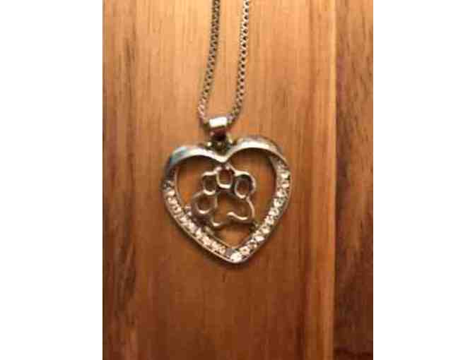Silvertone heart and paw necklace.